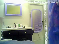 Small boobs chick with purple hair undressing in bathroom