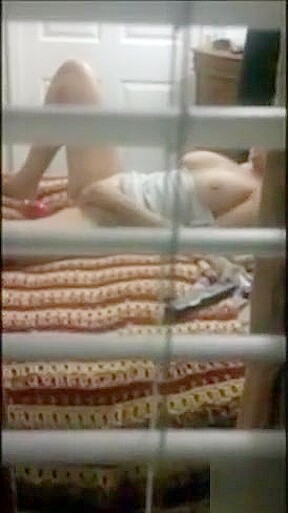 Spying my mum masturbating on bed