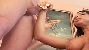 Stunning young brunette titty fucks a hard schlong