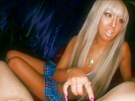 Tan asian with longs nails gives handjob on couch