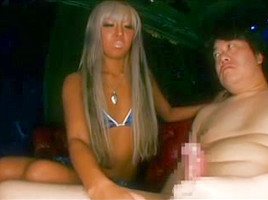 Tan asian with longs nails gives handjob on couch