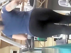 Tattooed woman running in treadmill