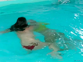 The girls take a swim and wrestle in the pool ( 1)