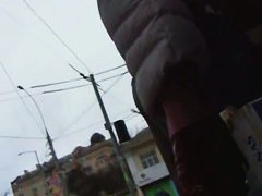 Three skinny bitches in knee-high boots get filmed in an upskirt video