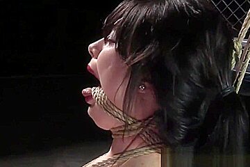 Tightly bound slave gal is whipped hard