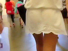 Tiny thong between firm butt cheeks