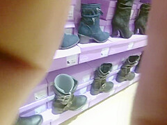 Trying heels and boot in a store
