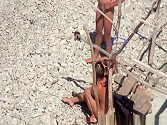 Two couples spied in the beach