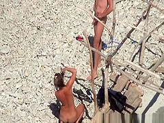 Two couples spied in the beach