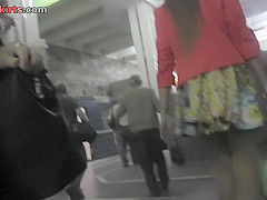 Upskirt vid made in public shows redhead in g-string