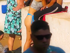 Voluptuous stunner has some fun at the beach in a flimsy bikini