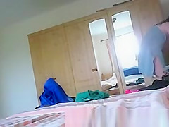Wet woman dressing in bedroom