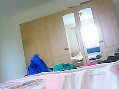 Wet woman dressing in bedroom