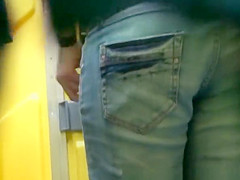 Woman pulls jeans pants and pees