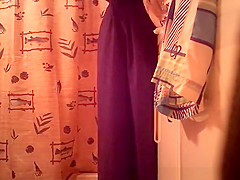 Woman spied in bathroom undressing