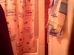 Woman spied in bathroom undressing