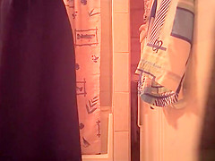 Woman spied in bathroom undressing