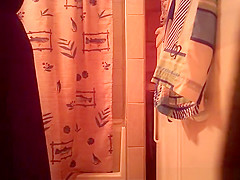 Woman spied in bathroom undressing