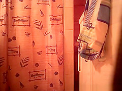 Woman spied in bathroom undressing