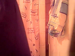 Woman spied in bathroom undressing
