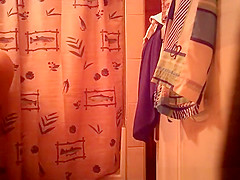 Woman spied in bathroom undressing