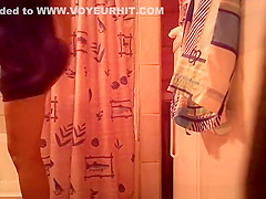 Woman spied in bathroom undressing