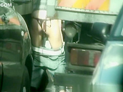 Woman spied peeing between some cars
