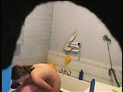 brunette girl gets nude and takes a quick bath in a shower porno
