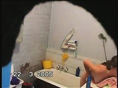 brunette girl gets nude and takes a quick bath in a shower porno