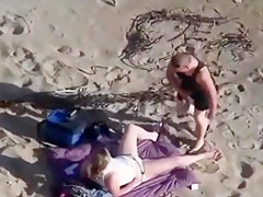 can't believe his eyes  strapon lesbian action at the beach !!!