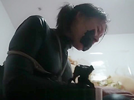 catsuit asian gets black tape gag but finally escapes