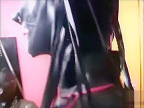 he in full rubber is bound and blindfolded, served by two maids