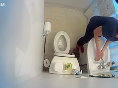over the toilet catches woman peeing