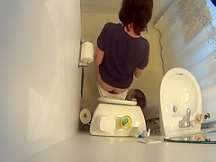 over the toilet catches woman peeing