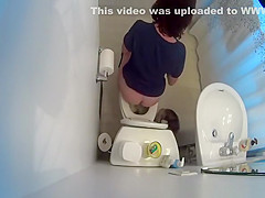 over the toilet catches woman peeing