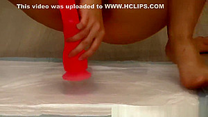 pissing and masturbation with a dildo, a young girl with little tits