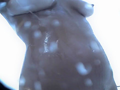 tanned blonde in the shower on the beach 