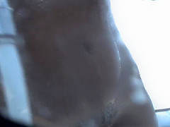 tanned blonde in the shower on the beach 